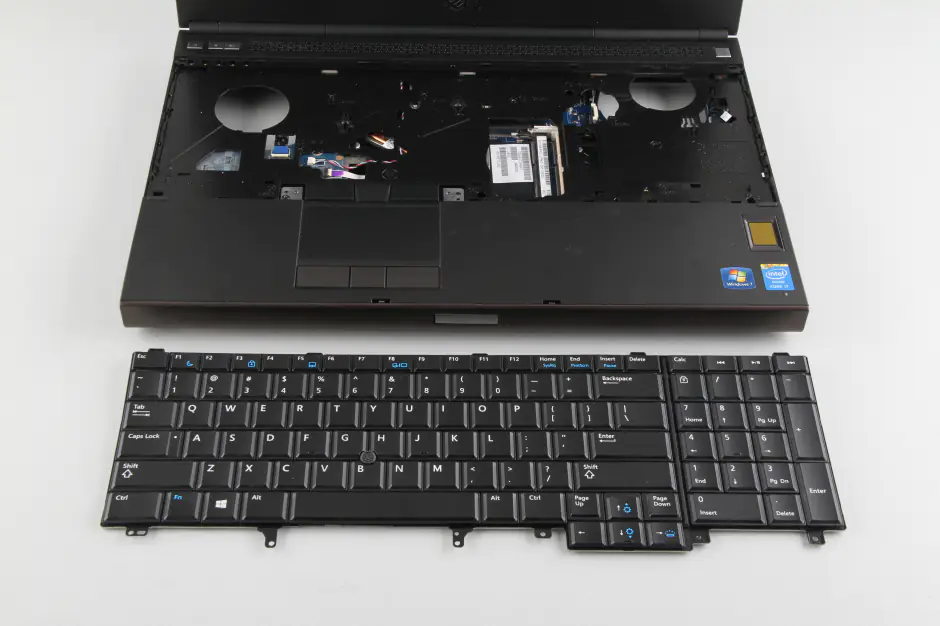 Remove the screws securing the palm rest